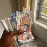 Nigerian Lady Shows Off Stacks Of Cash Allegedly Gifted At Davido’s Wedding (Video)