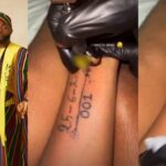 Diehard Fan Tattoos Davido and Chioma’s Wedding Date on Her Hand (Video)