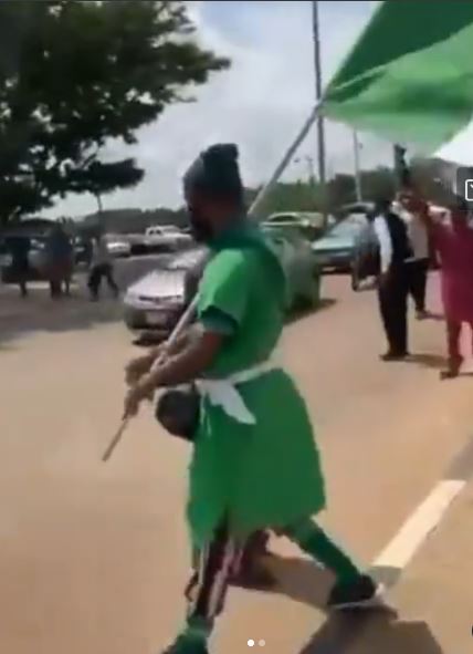 Popular Influencer, Flag Boy Arrested While Protesting Against Hunger In Abuja (Video)