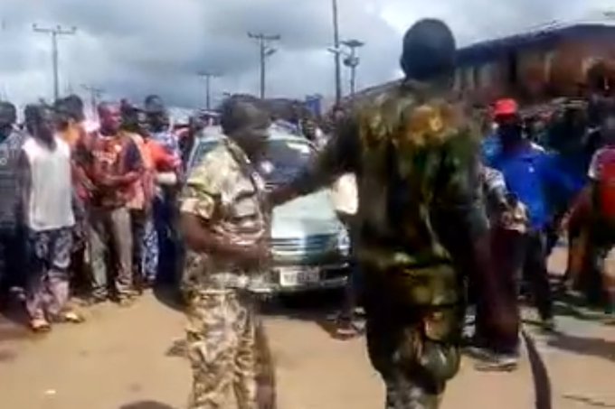 Nigerian Soldiers Caught On Camera Brutalizing Young Man In Public For Wearing Camouflage (Video)