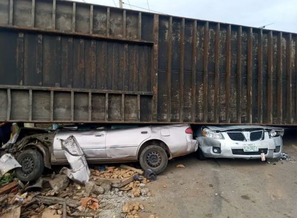 8 Children Narrowly Escape Death In Ghastly Accident As Container Falls On Cars In Kogi