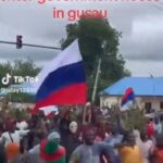 Viral Video Of Youths Brandishing Russian Flags While Marching Towards Zamfara State Government House