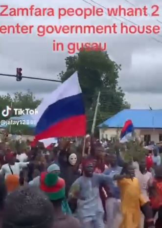 Viral Video Of Youths Brandishing Russian Flags While Marching Towards Zamfara State Government House