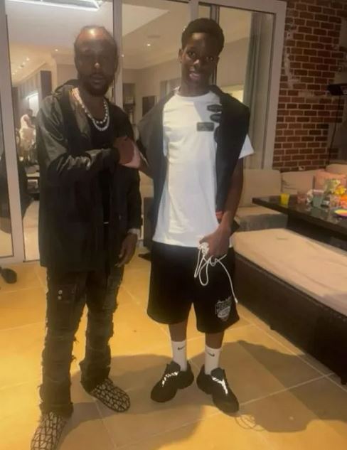 Wizkid’s Son, Bolu Spotted With Jamaican Singer, Popcaan In London