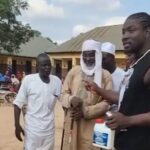 Drama As VeryDarkMan Storms Disability Home, Puts Prophet Fufeyin’s Holy Water To The Test (Video)