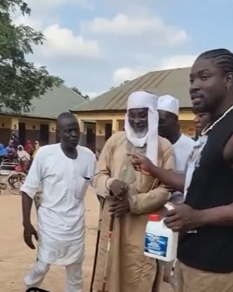 Drama As VeryDarkMan Storms Disability Home, Puts Prophet Fufeyin’s Holy Water To The Test (Video)