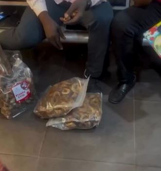 Video Purportedly Shows Staff Of A Logistics Company Eating Packaged Stockfish A Customer Brought For Waybill